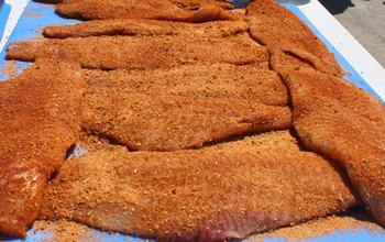 catfish fillets on a table ready to be cooked